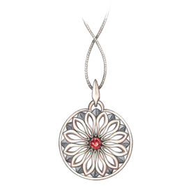 Silver filigree pendant with red gemstone